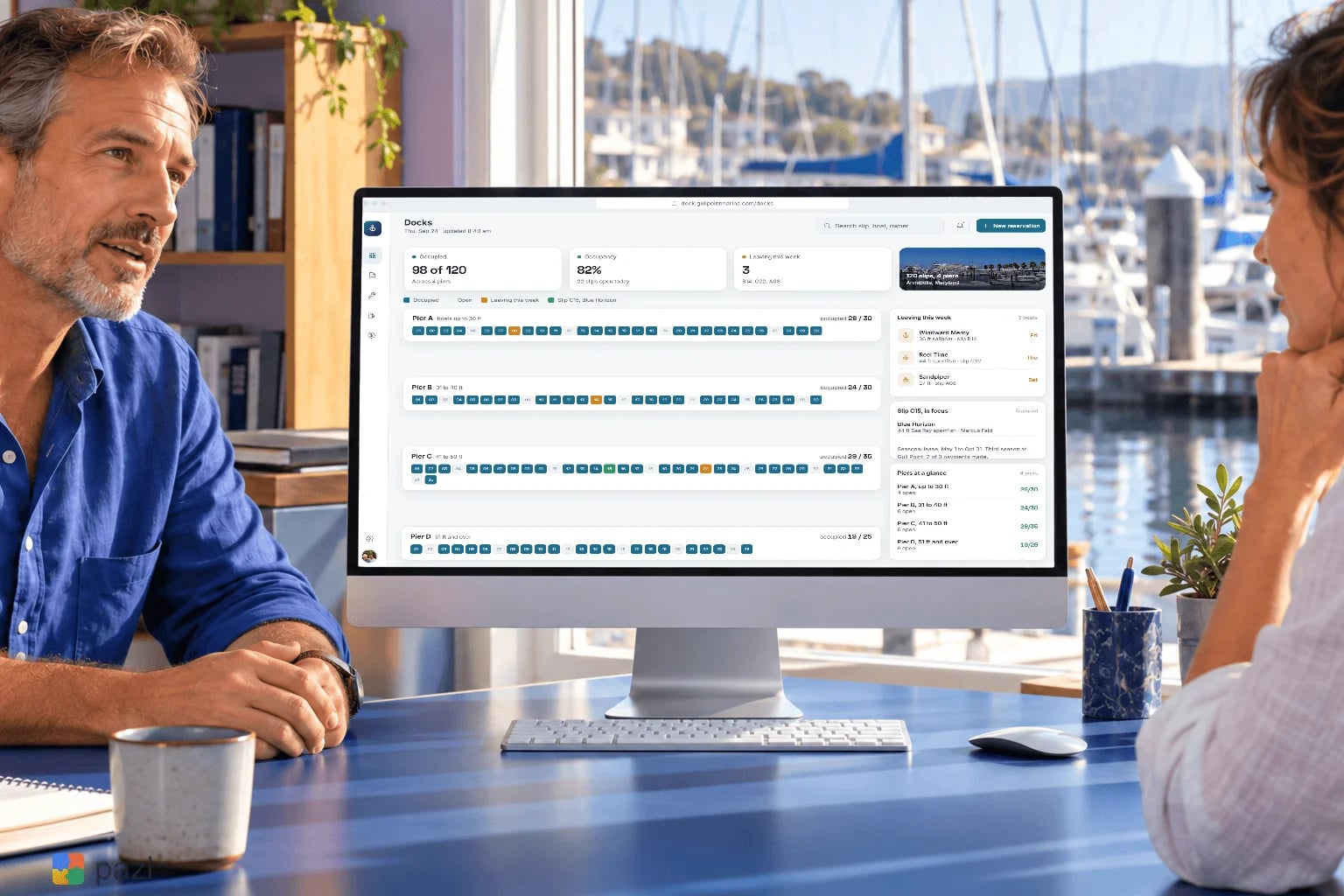 The Gull Point dock map on an office monitor, with the marina behind the window
